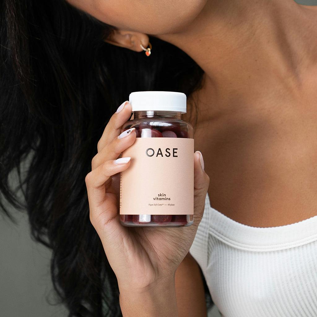 oase skin vitamins 1 month supply model hand close up
